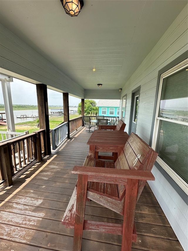 deck featuring a water view