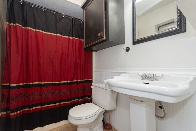 bathroom with sink and toilet