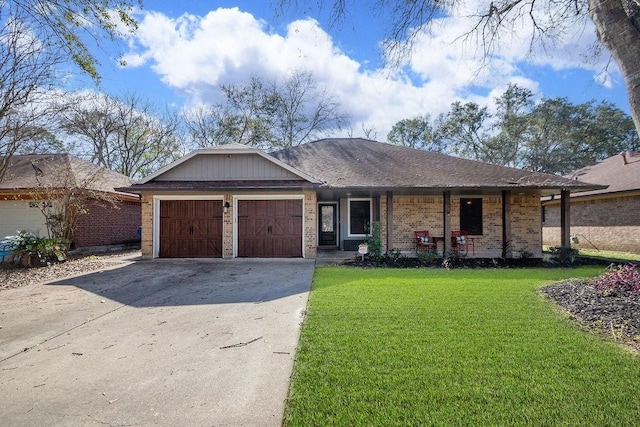 ranch-style home with a front yard and a garage