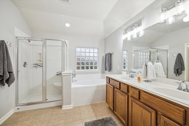 bathroom with separate shower and tub, tile patterned flooring, lofted ceiling, and vanity