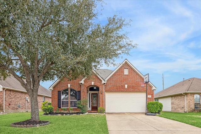 view of front of home with a front yard and a garage