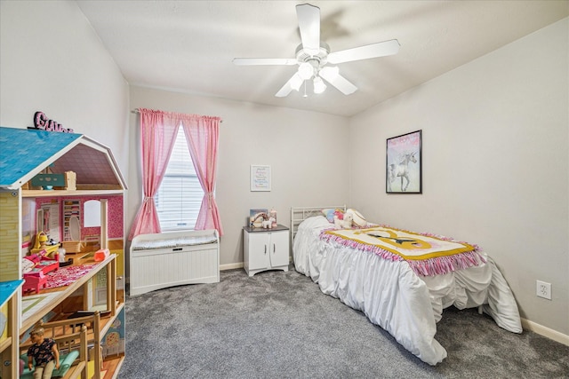 bedroom featuring ceiling fan and dark carpet