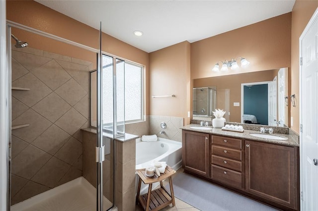 bathroom featuring vanity, tile patterned flooring, and independent shower and bath