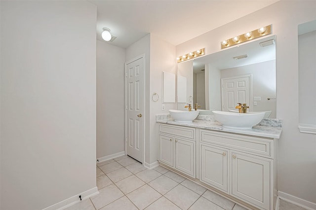 bathroom featuring tile patterned floors and vanity