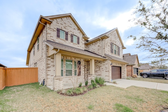 view of front facade featuring a front yard and a garage