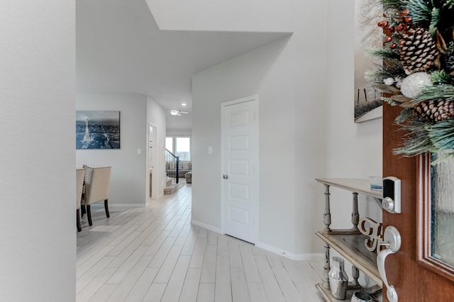 hall with light wood-type flooring