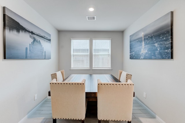 dining area with light tile patterned floors