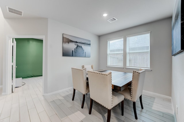 dining area featuring light wood-type flooring