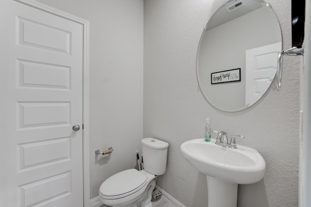 bathroom featuring sink and toilet