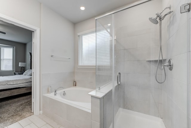 bathroom featuring tile patterned flooring, a wealth of natural light, and shower with separate bathtub