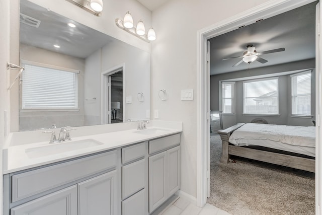 bathroom featuring ceiling fan, tile patterned floors, and vanity