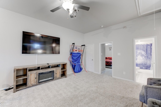 living room featuring light colored carpet and ceiling fan