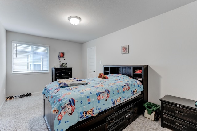 bedroom featuring light colored carpet