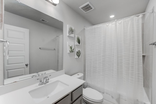 full bathroom featuring toilet, shower / bathtub combination with curtain, and vanity