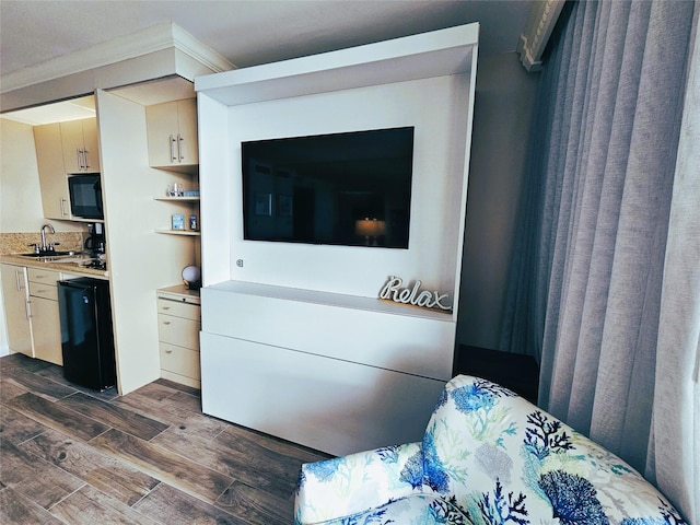 interior space with sink and crown molding