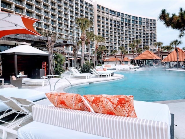 view of swimming pool featuring a gazebo, an outdoor hangout area, and a patio