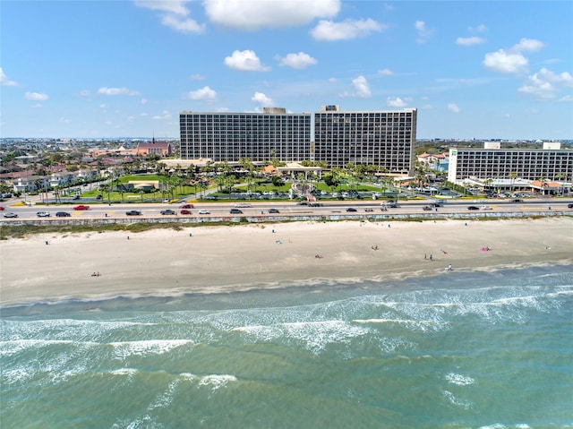 aerial view with a water view and a view of the beach