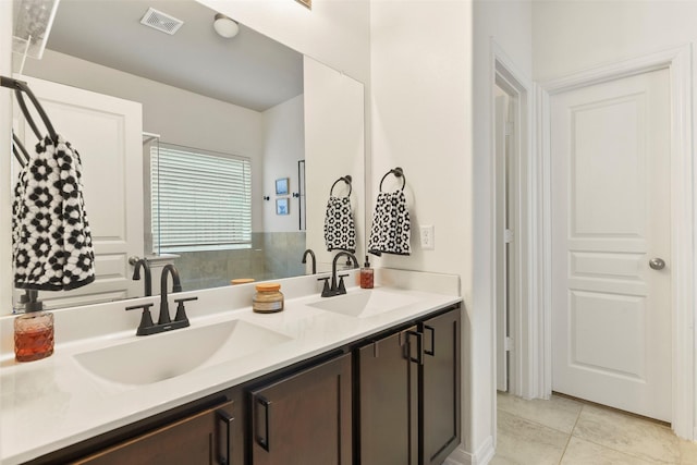 bathroom featuring tile patterned floors and vanity