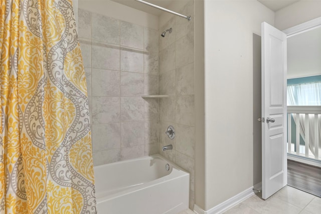 bathroom with tile patterned flooring and shower / bath combo with shower curtain