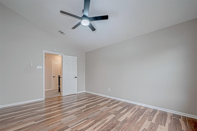 spare room with high vaulted ceiling, ceiling fan, and light hardwood / wood-style floors