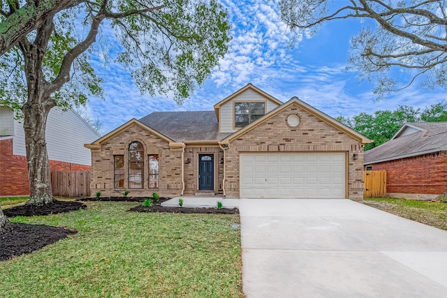 front facade featuring a front yard and a garage