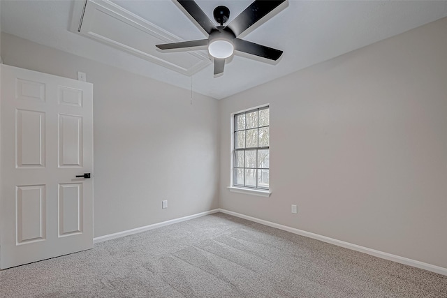 carpeted spare room with ceiling fan