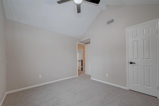 unfurnished bedroom featuring ceiling fan, light carpet, and lofted ceiling