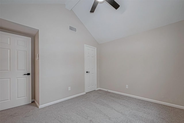 unfurnished bedroom with ceiling fan, light colored carpet, and high vaulted ceiling