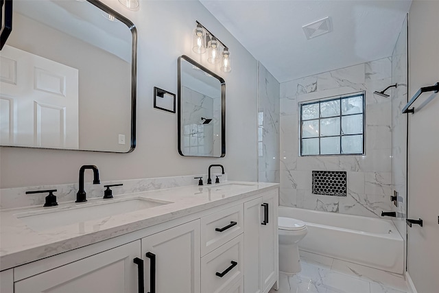 full bathroom with toilet, tiled shower / bath combo, and vanity