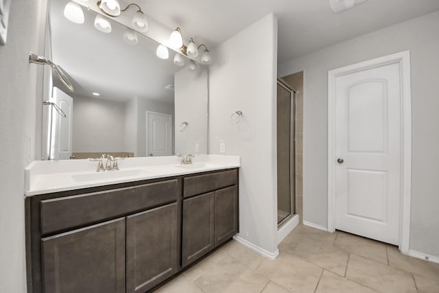 bathroom featuring vanity, tile patterned flooring, and walk in shower