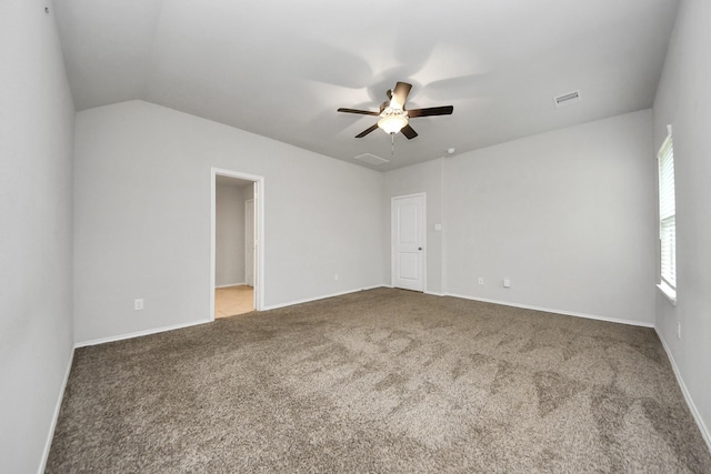 unfurnished room featuring ceiling fan, carpet, and vaulted ceiling