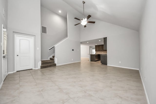 unfurnished living room featuring ceiling fan, light tile patterned floors, and high vaulted ceiling