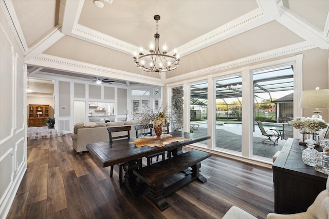 dining space featuring ceiling fan with notable chandelier, dark hardwood / wood-style flooring, and crown molding