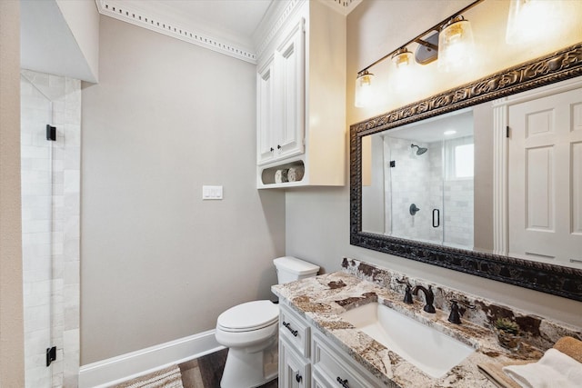 bathroom featuring toilet, a shower with door, hardwood / wood-style floors, and vanity