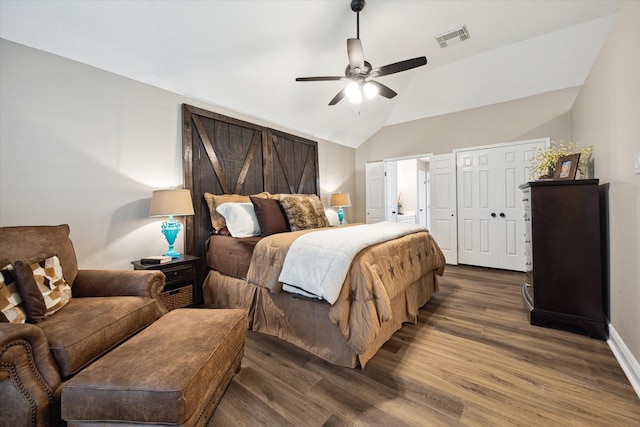 bedroom with lofted ceiling, ceiling fan, and dark hardwood / wood-style flooring