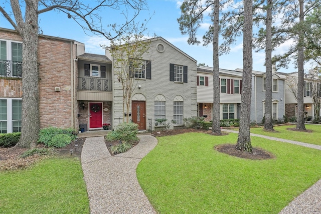 view of property featuring a front yard