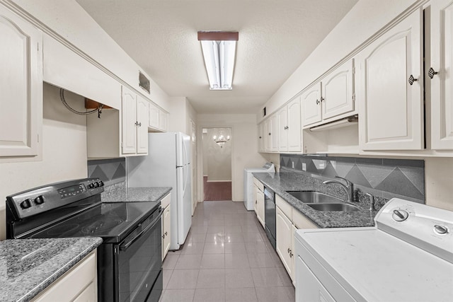 kitchen featuring washer / dryer, black appliances, white cabinets, and sink