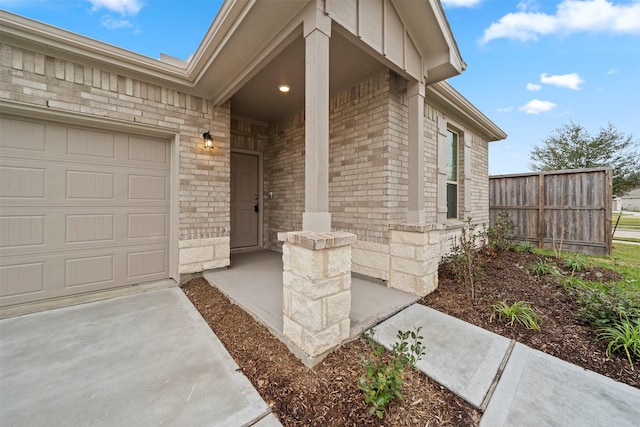 view of exterior entry featuring a garage