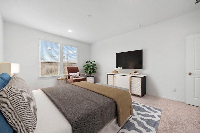 bedroom featuring light colored carpet