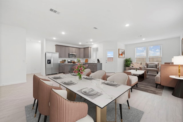 dining area featuring light hardwood / wood-style flooring