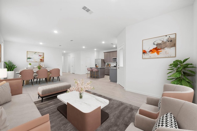 living room with light hardwood / wood-style flooring