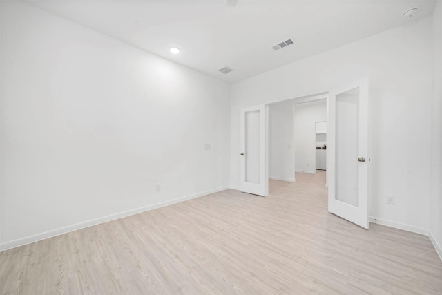 unfurnished room featuring light hardwood / wood-style floors