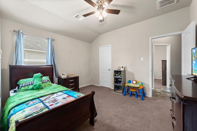 carpeted bedroom featuring vaulted ceiling and ceiling fan