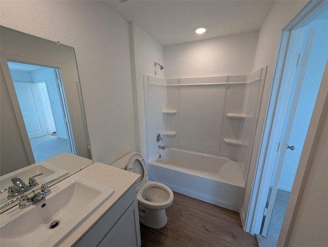 full bathroom with toilet, bathtub / shower combination, vanity, and hardwood / wood-style flooring