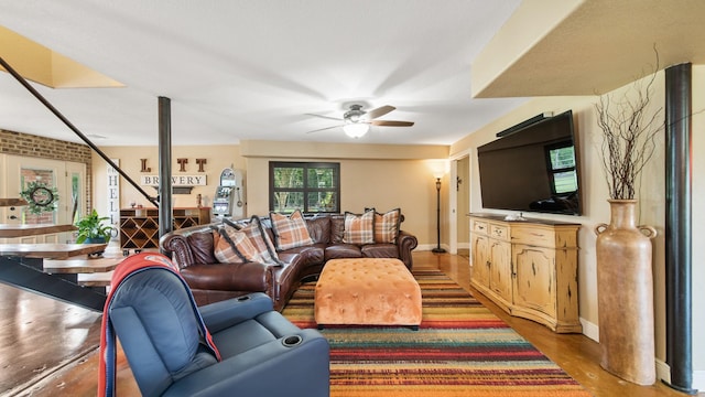 living room featuring hardwood / wood-style flooring and ceiling fan