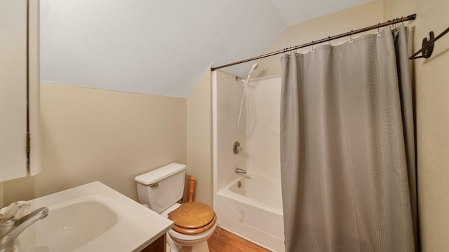 full bathroom featuring lofted ceiling, sink, wood-type flooring, shower / bath combination with curtain, and toilet