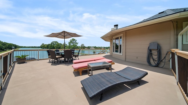 view of patio with a water view