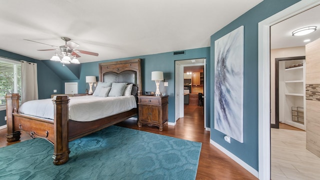 bedroom with ceiling fan and hardwood / wood-style floors