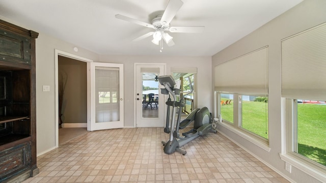 exercise area featuring french doors and ceiling fan