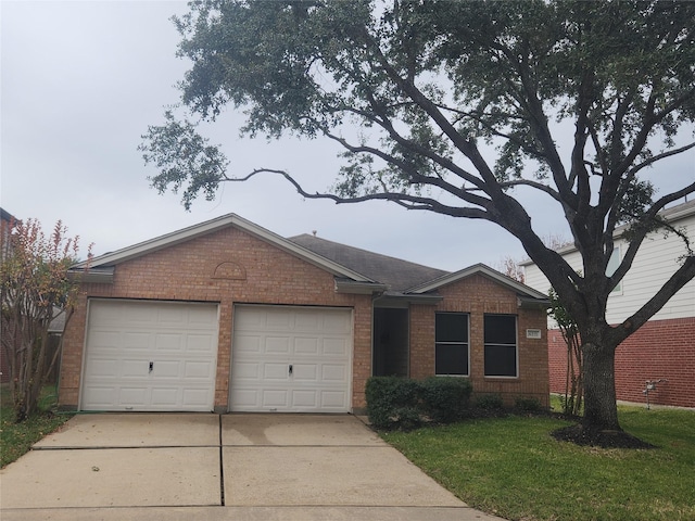 single story home featuring a garage and a front lawn